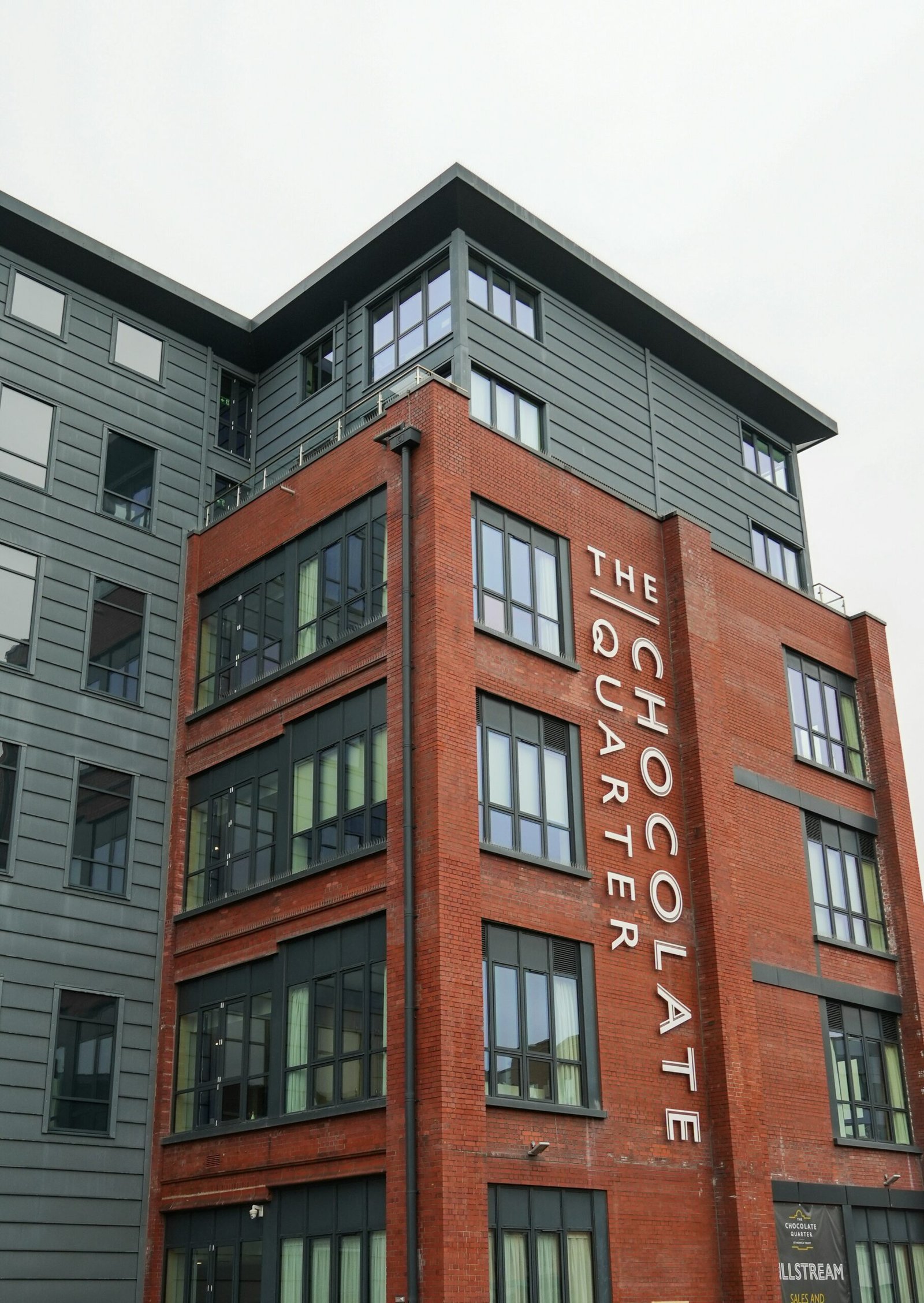 The chocolate quarter building with red brick facade.