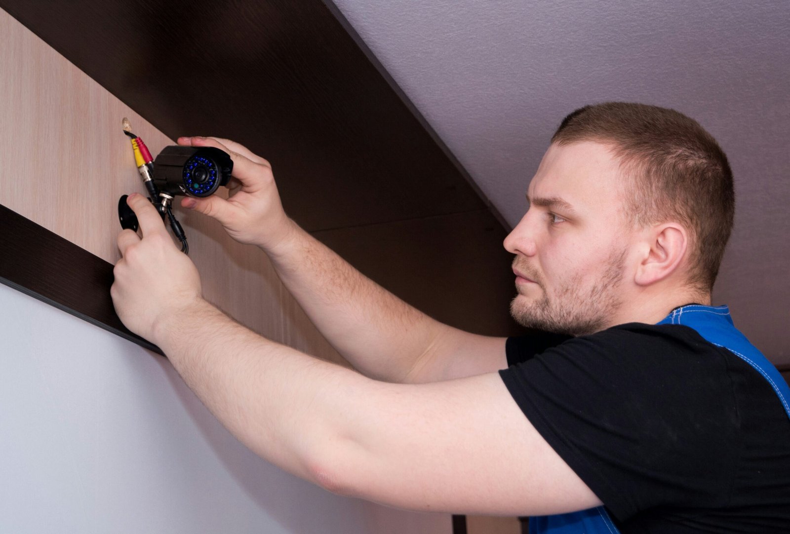 How Appraisals Influence Your Refinance Terms a man working on a wall with a screwdriver