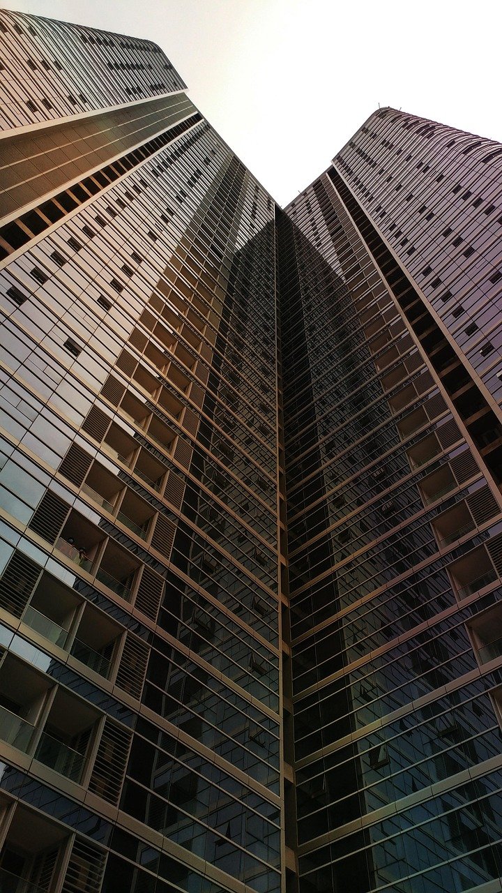 City towers and waterfront reflections at night for Custom Loan Structures to Ease Pressure & Protect Timelines