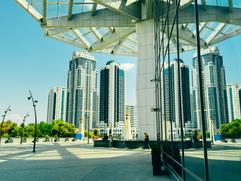 Commercial plaza and high-rise buildings reflected in glass for CRE Debt Placement FAQ & Capital Solutions | Thorne CRE