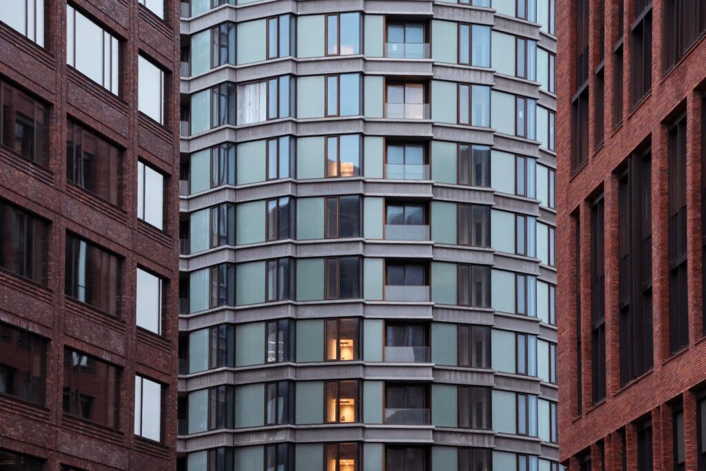Urban mixed-use buildings with brick and glass facades for Office Financing Solutions & Insights | Thorne CRE