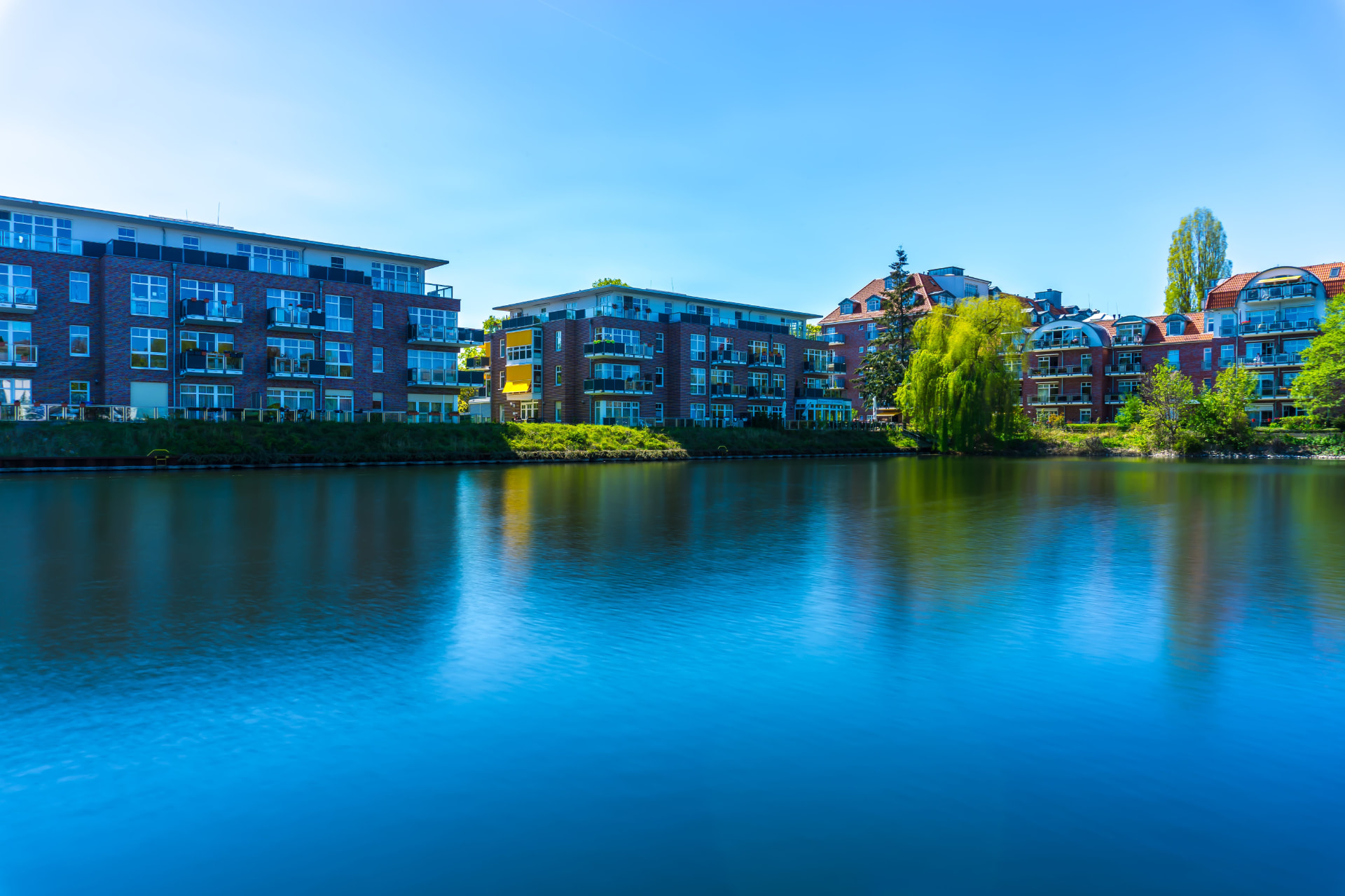 Waterfront apartment community on a landscaped shoreline for Commercial Construction Loan Draw Schedule Breakdown: Sponsor Fi