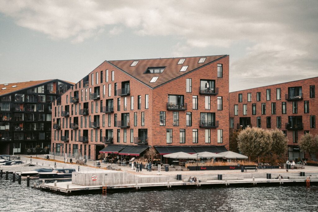 Waterfront brick apartment community with ground-floor retail for CRE Debt Advisory Firms for Mid-Market Bridge Loans