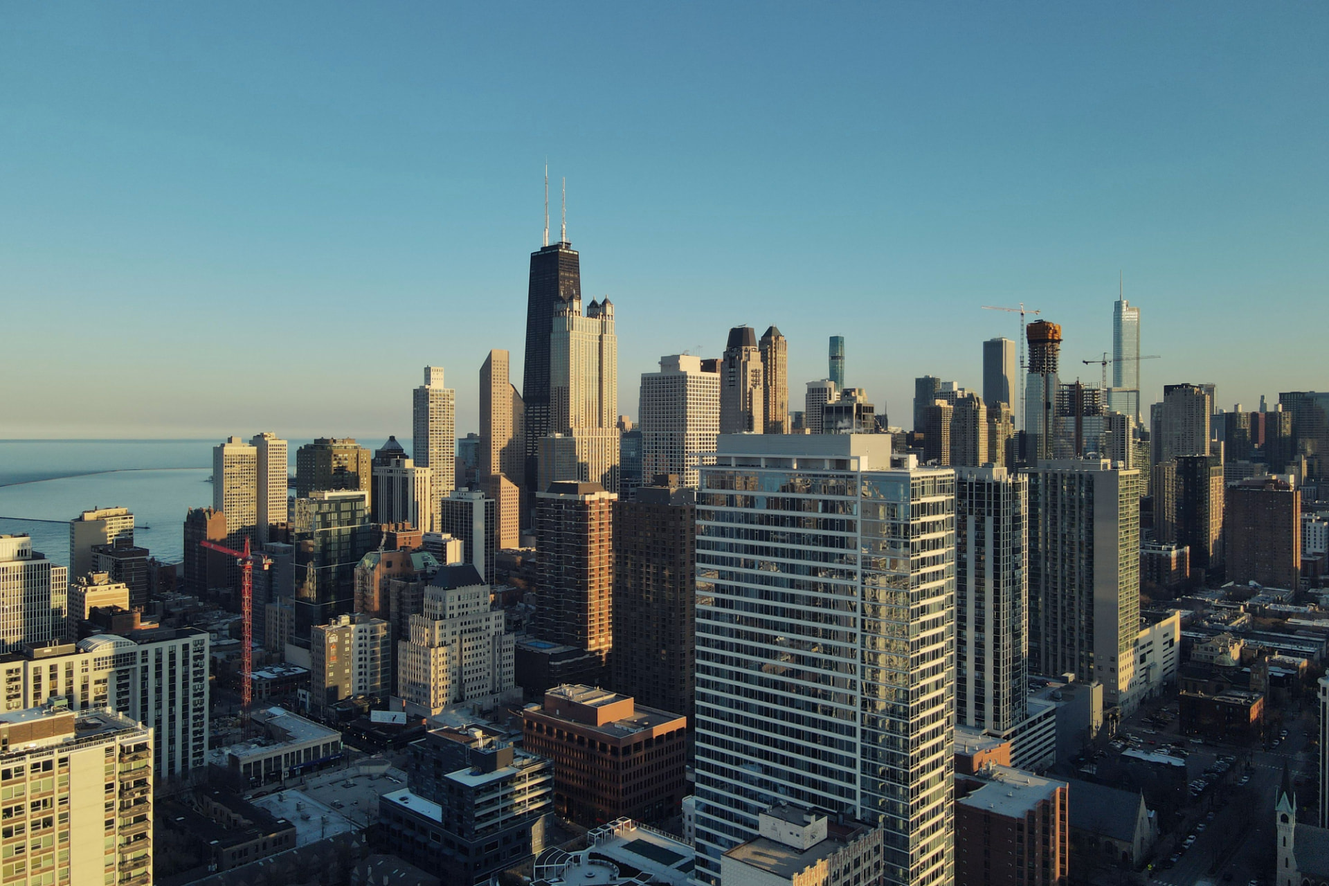 Chicago high-rise buildings overlooking Lake Michigan in daylight for Broker Referral Partner Programs for Commercial Real Es