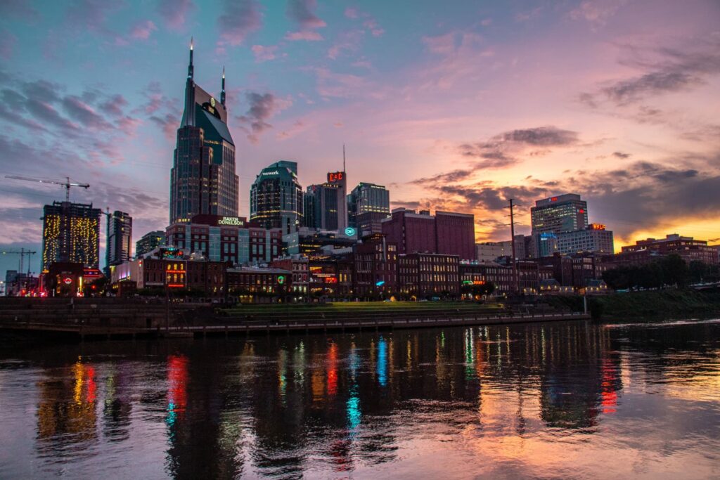 Downtown Nashville skyline reflected in the river at sunset for Commercial Real Estate Capital Stack: Optimization & Maturity